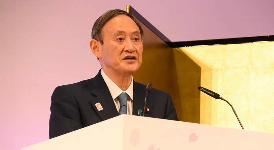 Former Prime Minister Yoshihide Suga delivers opening remarks