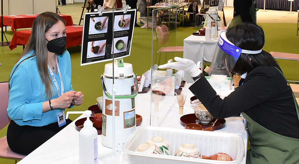 A participant enjoys some Japanese culture at the Exhibition Hall