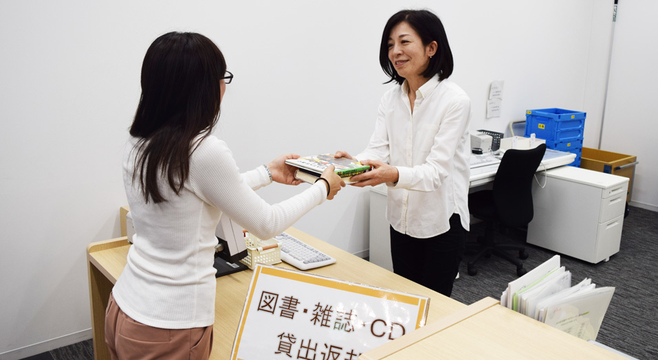 Staff member accepting the returned book